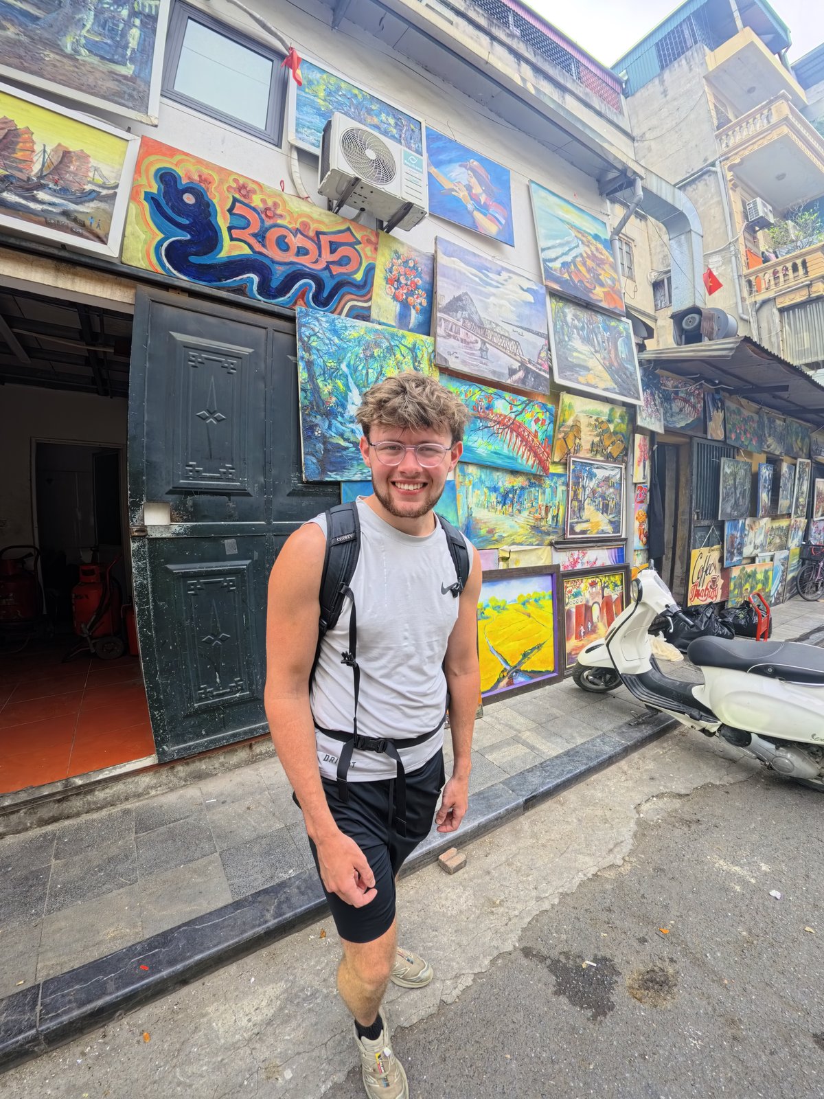 Charlie Bowman smiling outdoors on a city street